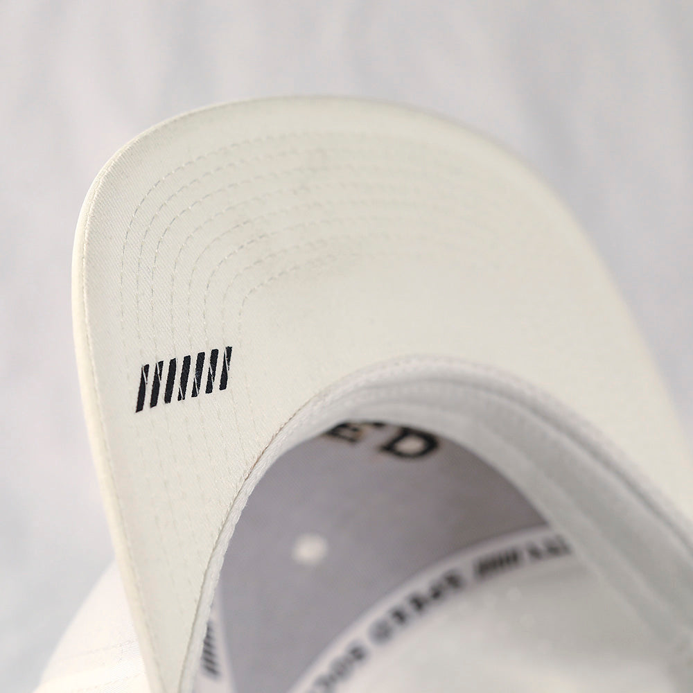 White Speed Society Avenue laser-perforated snapback, lifestyle photo